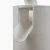A close-up, side view of a white plastic dispenser spout. Produktbild-Vorschau