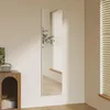 A full-length mirror is shown leaning against a wall in a room with blinds and a wooden cabinet. Produktbild-Vorschau
