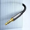 A close-up shot of a Ugreen audio cable connector against a textured glass background. Produktbild-Vorschau