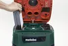 A hand is shown inserting a filter into an open Metabo vacuum cleaner. Náhľad obrázku produktu
