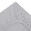 A close-up view of a light gray fitted sheet, showing the elasticized edge and fabric texture. Produktbild-Vorschau