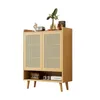 A wooden cabinet with rattan doors and shelves, displayed against a white background. Produktbild-Vorschau