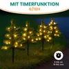 Three small, illuminated Christmas trees are displayed outdoors at dusk. Produktbild-Vorschau