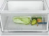 A close-up view of a refrigerator drawer filled with fresh produce, including a head of napa cabbage and several pears. Produktbild-Vorschau