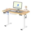 A white standing desk with a wooden top, set up with a computer, keyboard, mouse, headphones, and accessories. Podgląd zdjęcia produktu