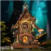 A 3D wooden puzzle cuckoo clock in a whimsical forest setting with glowing mushrooms and fireflies. Náhľad obrázku produktu