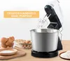 A kitchen mixer with a stainless steel bowl and ingredients for baking. Produktbild-Vorschau