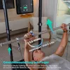 A man is using a home gym machine, lifting a barbell. Produktbild-Vorschau