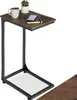 A small side table with a coffee mug, a plant, and a notebook on top. Náhled obrázku produktu