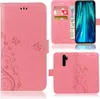 A collage of images showing a pink phone case with a floral and butterfly design. Produktbild-Vorschau