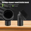 Two black vacuum cleaner attachments are displayed on a wooden surface against a black background. Text overlays describe the product. Produktbild-Vorschau