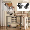 A person is shown pushing a bar cart in a kitchen or dining area. The cart is stocked with wine bottles, glasses, and other items. Podgląd zdjęcia produktu