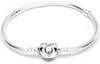 A silver Pandora bracelet with a heart-shaped clasp is displayed against a white background. Produktbild-Vorschau