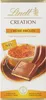 A chocolate bar wrapper with an image of creme brulee and caramel. Produktbild-Vorschau