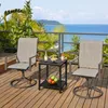 A patio set with two chairs and a small table on a wooden deck overlooking the ocean. Produktbild-Vorschau