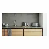 A modern kitchen counter with a sink, faucet, toaster, and storage containers. Anteprima dell’immagine prodotto
