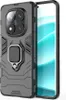 A black protective phone case with a ring holder is shown next to a smartphone. Náhled obrázku produktu