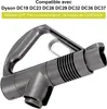 A close-up of a vacuum cleaner handle attachment. Produktbild-Vorschau