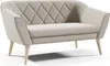 A beige sofa with diamond tufting on the backrest and wooden legs, presented on a white background. Anteprima dell’immagine prodotto