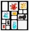 A collection of white plates with various food items arranged on them, set against a black background. Produktbild-Vorschau