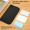 A black card holder is shown on a wooden surface, with three blank cards next to it. Text overlays describe the product's anti-theft technology. Produktbild-Vorschau