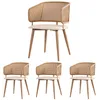 A set of four dining chairs with rattan backs and beige upholstered seats, presented on a white background. Produktbild-Vorschau