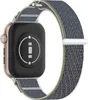 The back of a smartwatch with a fabric band is shown against a white background. Náhled obrázku produktu
