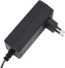 A black power adapter with a European plug. Voir les images du produit