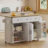 A kitchen island with storage and a fold-out countertop in a kitchen setting. Voir les images du produit