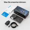 A flat lay of a wireless charging station and its accessories, including a power adapter and cable, along with the product box and manual. Produktbild-Vorschau