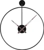 A minimalist black metal wall clock with brown hands against a white background. Anteprima dell’immagine prodotto