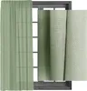 A sheer green curtain is shown hanging in front of a window, with a close-up of the fabric texture on the right. Produktbild-Vorschau