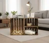 Two wooden crates are stacked and arranged as a side table in a living room setting, with a sofa and lamp in the background. Anteprima dell’immagine prodotto