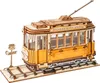 A 3D wooden model of a tram on a track with a station sign. Produktbild-Vorschau