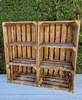 Two wooden crates with shelves are displayed outdoors against a green hedge. Náhled obrázku produktu