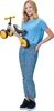 A woman is holding a small balance bike. Anteprima dell’immagine prodotto