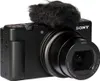 A black Sony ZV-1 II digital camera with a furry microphone attachment is shown against a white background. Produktbild-Vorschau