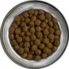 A top-down view of a bowl filled with dog food kibble. Náhľad obrázku produktu