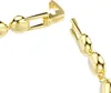 A close-up view of a gold bracelet clasp and chain. Anteprima dell’immagine prodotto