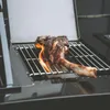 A large steak is being grilled on a gas grill, with flames visible. Náhled obrázku produktu