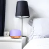 Aroma diffuser on a nightstand next to a bed. Anteprima dell’immagine prodotto