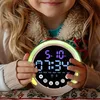 A child is holding a digital alarm clock with a colorful light ring. Produktbild-Vorschau