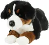 A plush toy dog lying down. Produktbild-Vorschau