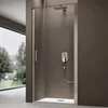 A modern shower enclosure with a sleek design, featuring a glass door, chrome fixtures, and a rainfall showerhead. The background is a neutral brown, and a large window reveals a lush green outdoor landscape. Produktbild-Vorschau