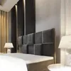 A bedroom scene with a bed, headboard, and lamps. Produktbild-Vorschau