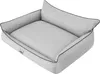 A light gray dog bed with raised sides and a pillow-like headrest, presented from a slightly elevated angle. Náhled obrázku produktu