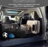 The trunk of a car is filled with luggage and other items, suggesting travel or storage. Produktbild-Vorschau