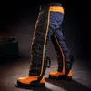 Product shot of chainsaw protective pants and boots. Produktbild-Vorschau
