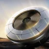 A futuristic, metallic device with a coiled center sits on a rocky, barren surface, illuminated by bright, directional light. Podgląd zdjęcia produktu