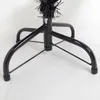 Close-up of the base of a black artificial Christmas tree. Produktbild-Vorschau